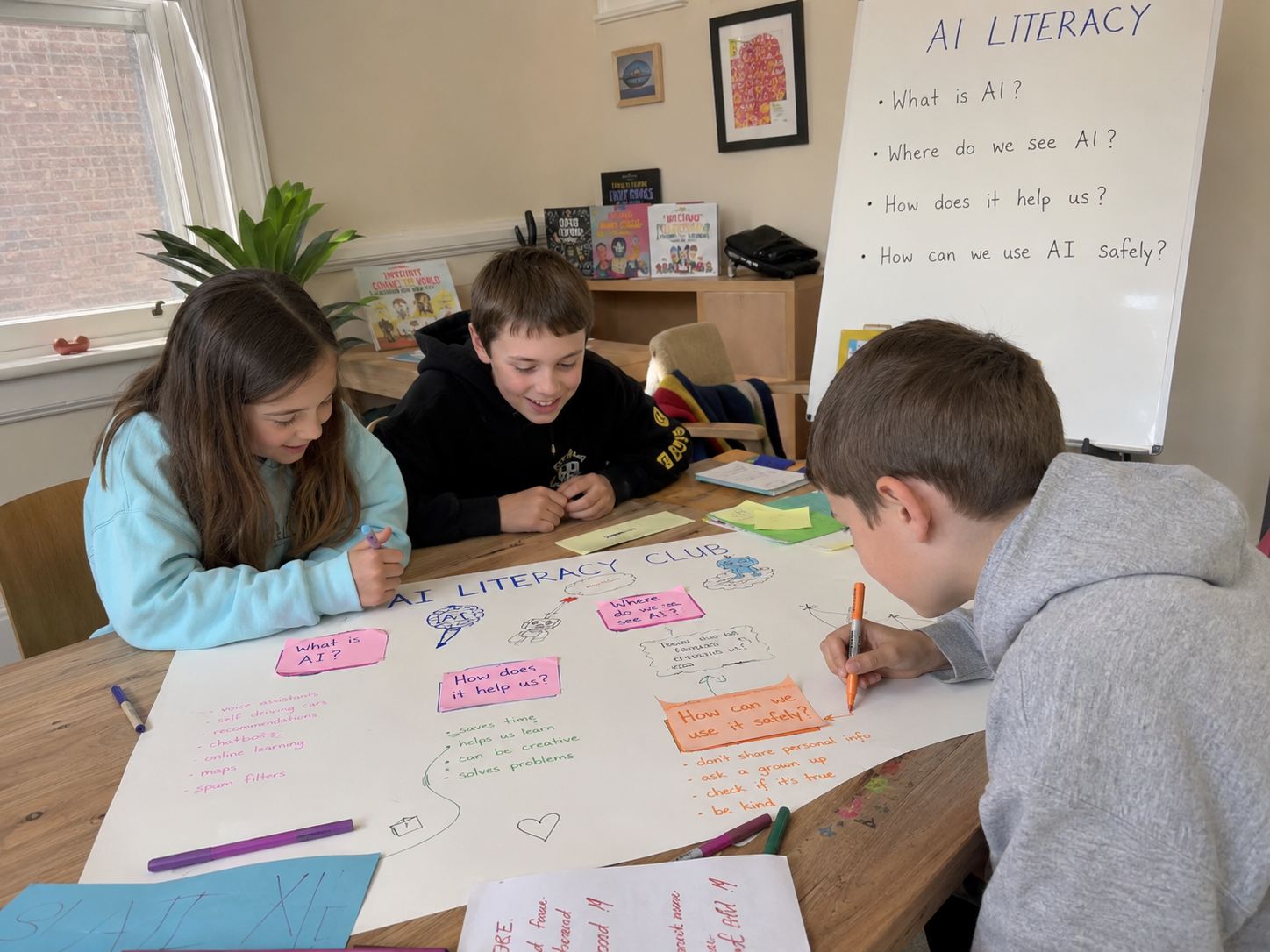 Children mapping out what AI is on a poster at Configur AI Junior