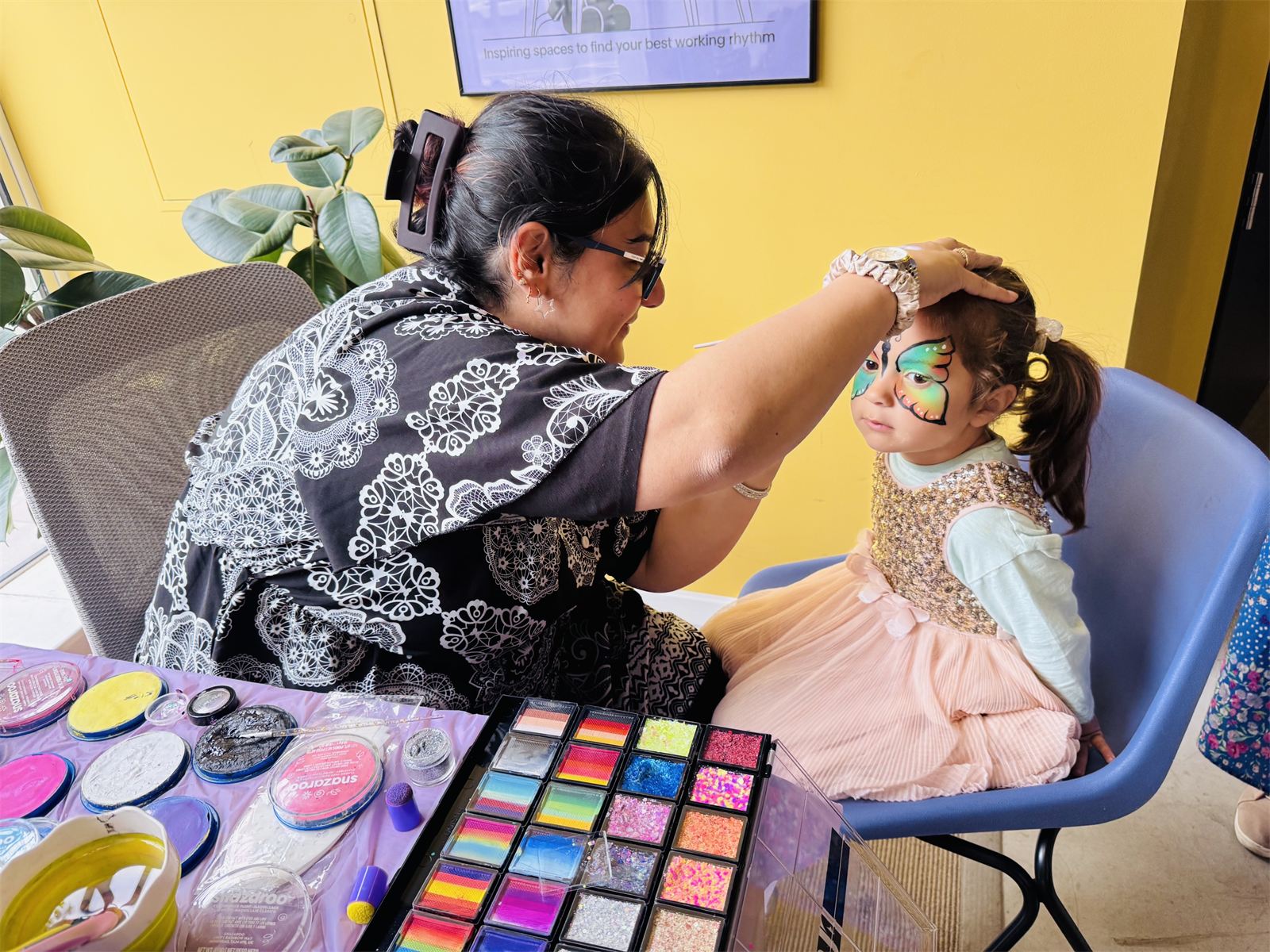 A child having their face painted at the Young Founders Market