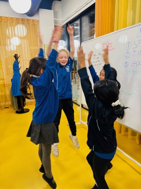 Children working together in a team at Rise to Lead